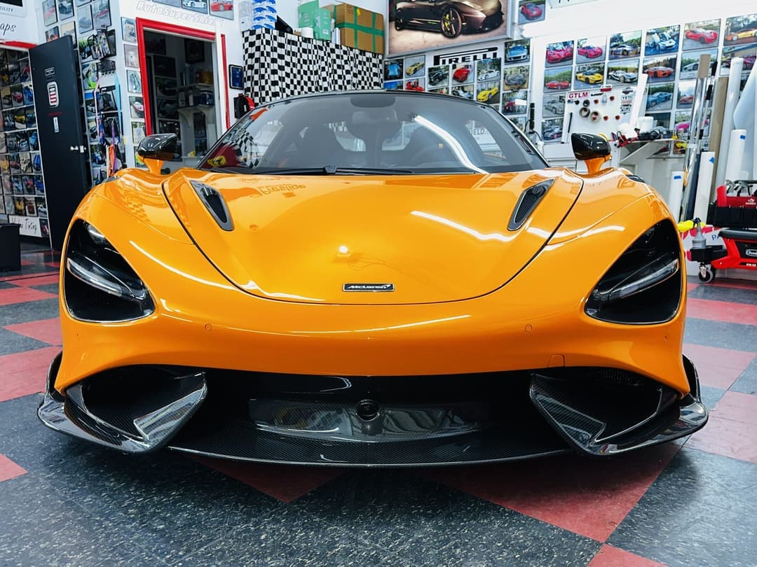 McLaren 765LT with exposed carbon fibre bodywork in an Auto SuperShield service bay